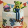 Cocomelon Cody and friends birthday cake with green frog topper and custom name for kids by Sweet Cakery Bangalore