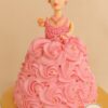 Doll theme cake from Sweet Cakery with pink cream rosette gown, golden pearls, realistic doll topper