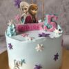 Frozen theme birthday cake by Sweet Cakery in Bangalore featuring Elsa, Anna topper, Olaf decoration, pastel blue cream, and snowflake accents.