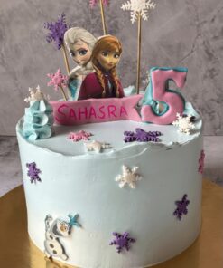 Frozen theme birthday cake by Sweet Cakery in Bangalore featuring Elsa, Anna topper, Olaf decoration, pastel blue cream, and snowflake accents.