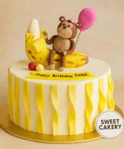 Celebrate your little one's birthday with our adorable Monkey on Banana Cake, perfect for jungle-themed parties and is sure to delight any child.