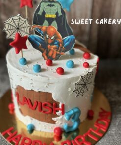 High-quality photo of a Spiderman theme birthday cake from Sweet Cakery, decorated with Spiderman topper, web details, red and blue stars, and comic elements.