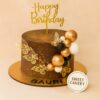 Golden butterfly and balloon cake by Sweet Cakery, featuring metallic balloons, delicate butterflies, and chocolate finish