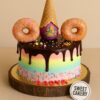 Sweet Cakery’s 100% eggless ice cream and donut design cake featuring pastel rainbow buttercream, chocolate drip, donuts, waffle cone and sprinkles