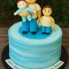 Family-themed birthday cake with edible custom figurines, handcrafted topper, smooth blue buttercream, and Sweet Cakery sticker — Bangalore delivery.