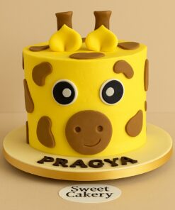 Giraffe themed birthday cake with fondant eyes and brown spots. Delivery Across Bangalore