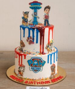 Paw Patrol birthday cake with red and blue drips, sprinkles, and toppers – Sweet Cakery Bangalore