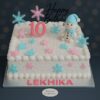 Snowman Birthday Cake in Bangalore – Eggless winter theme cake with snowflakes and snowman topper by Sweet Cakery