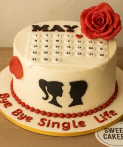 A bachelorette theme cake with a calendar topper, red rose, romantic couple silhouettes, and “Bye Bye Single Life” message.
