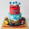 Custom Disney Cars theme birthday cake in Bangalore. Fun design with cars, road scenes, and details. 100% eggless & personalised.