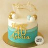 Elegant 40th birthday cake from Sweet Cakery with cream icing, gold sugar sail, decorative fondant spheres and modern blue design.