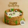 Panda theme birthday cake by Sweet Cakery in Bangalore featuring cute panda toppers, wafer stick bamboo border, green leaves, golden topper, 100% eggless custom cake