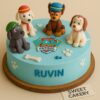 A 100% eggless Paw Patrol birthday cake by Sweet Cakery featuring handcrafted fondant pups, paw prints, edible bone elements.