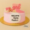 Pastel pink welcome baby cake by Sweet Cakery with fondant sleeping baby, “It’s a girl” topper