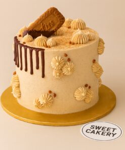Lotus Biscoff themed cake with biscuit topping, chocolate drip, and whipped cream details from Sweet Cakery Bangalore