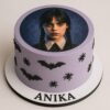 Spooky Wednesday theme birthday cake with circular edible photo print, bats, and spiders from Sweet Cakery Bangalore
